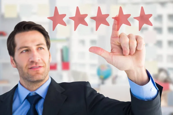 Confident businessman pointing at something — Stock Photo, Image