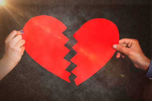 Two hands holding broken heart — Stock Photo, Image