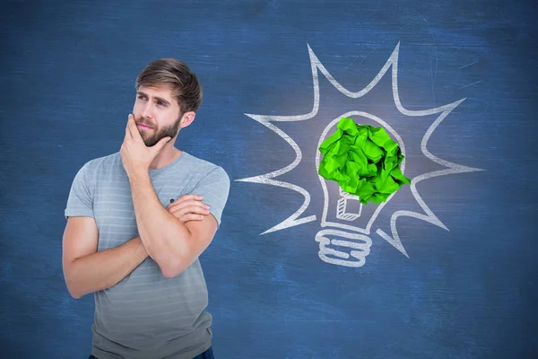 Thoughtful man against  chalkboard — Stock Photo, Image