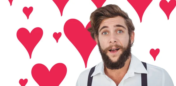 Verbaasd hipster tegen Valentijnsdag patroon — Stockfoto