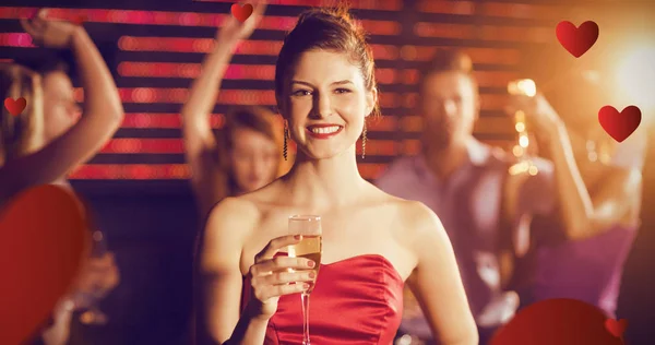 Woman holding glass of champagne — Stock Photo, Image