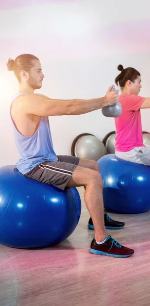 Men performing stretching exercise — Stock Photo, Image