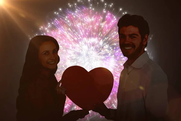 Couple holding paper heart — Stock Photo, Image