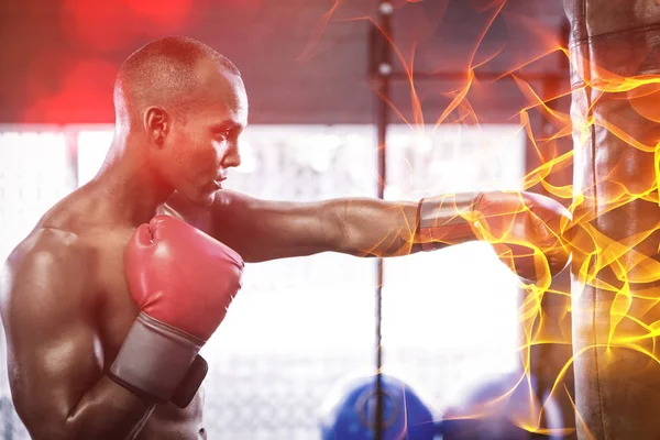 Side view of male boxer punching bag — Stock Photo, Image