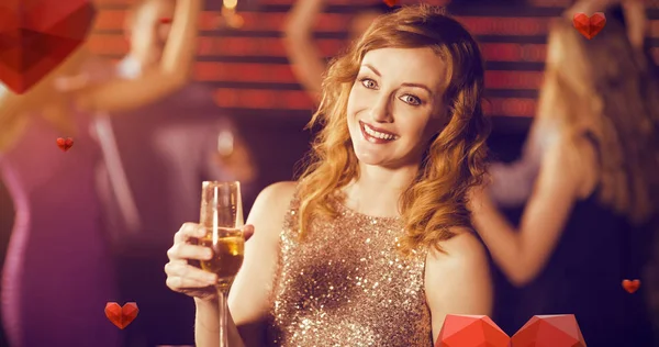 Woman holding a glass of champagne — Stock Photo, Image
