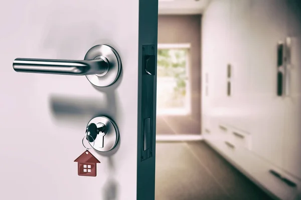 Open door with house key — Stock Photo, Image