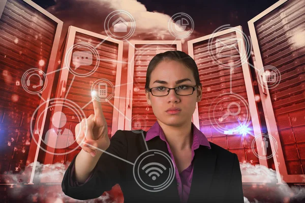 Composite image of serious businesswoman pointing — Stock Photo, Image