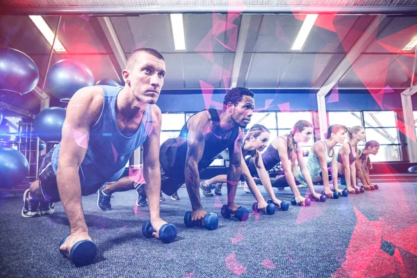 Fitness class in plank position with dumbbells — Stock Photo, Image