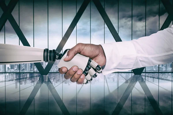 Composite image of computer graphic image of businessman and robot shaking hands — Stock Photo, Image