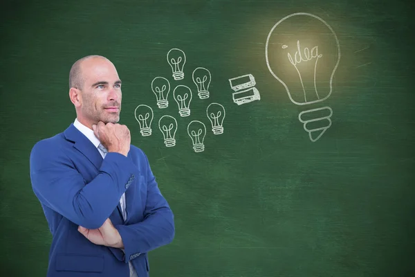 Thoughtful businessman with hand on chin — Stock Photo, Image