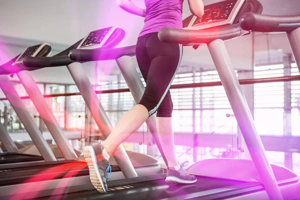 Lower section of fit woman on treadmill — Stock Photo, Image