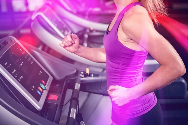 Woman walking on treadmill — Stock Photo, Image