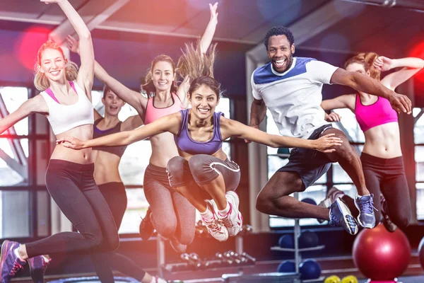 Fit group smiling and jumping Stock Picture