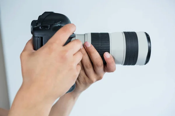 Photographer holding digital camera — Stock Photo, Image