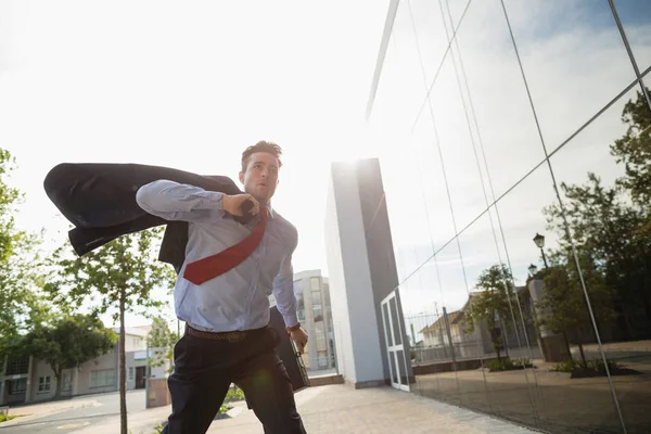 Businessman running outside — Stock Photo, Image