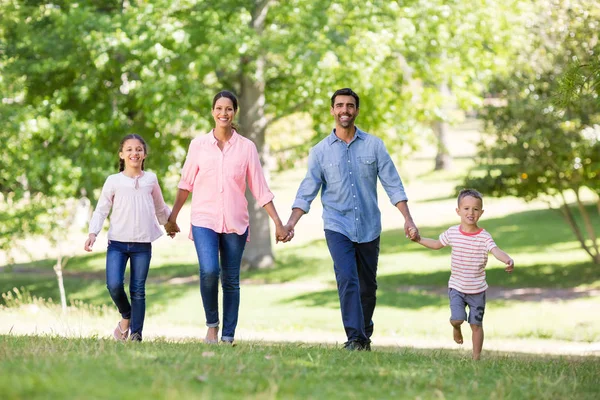 Portrait of happy family enjoying together in park — Stock Photo, Image