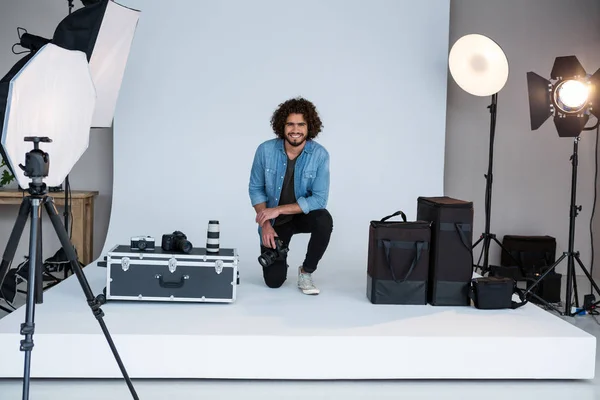 Happy male photographer in studio — Stock Photo, Image