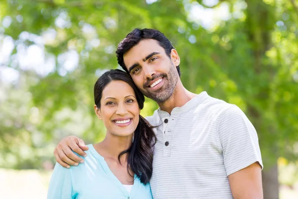 Portrait of couple standing together in park — Stock Photo, Image