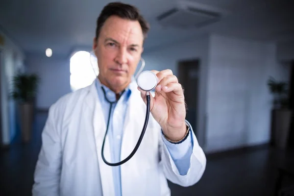 Portrait of male doctor holding stethoscope — Stock Photo, Image