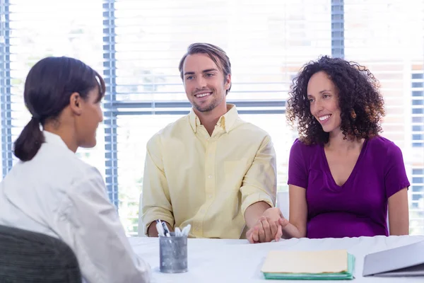 Couple interacting with doctor — Stock Photo, Image