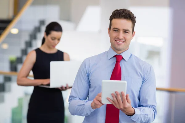 Businessman holding a digital tablet — Stock Photo, Image