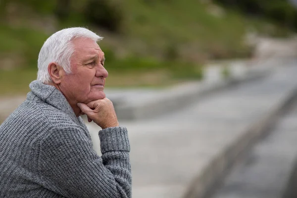 Senior man sitting on the steps — Stock Photo, Image