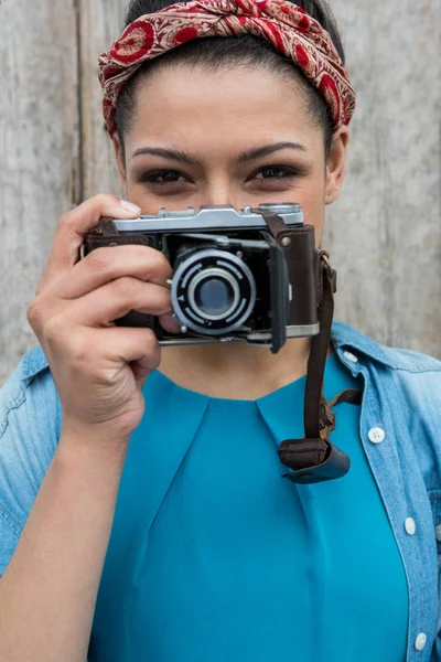 Photographer with old fashioned camera Stock Picture