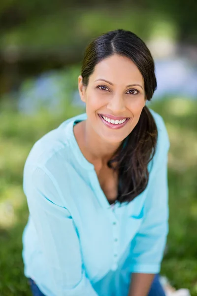 Portrait of woman smiling in park Royalty Free Stock Images