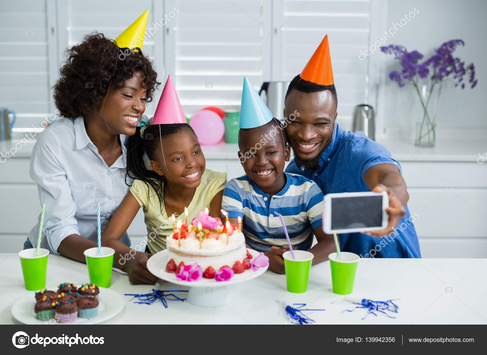 Happy family celebrating birthday party at home Stock Photo by ...