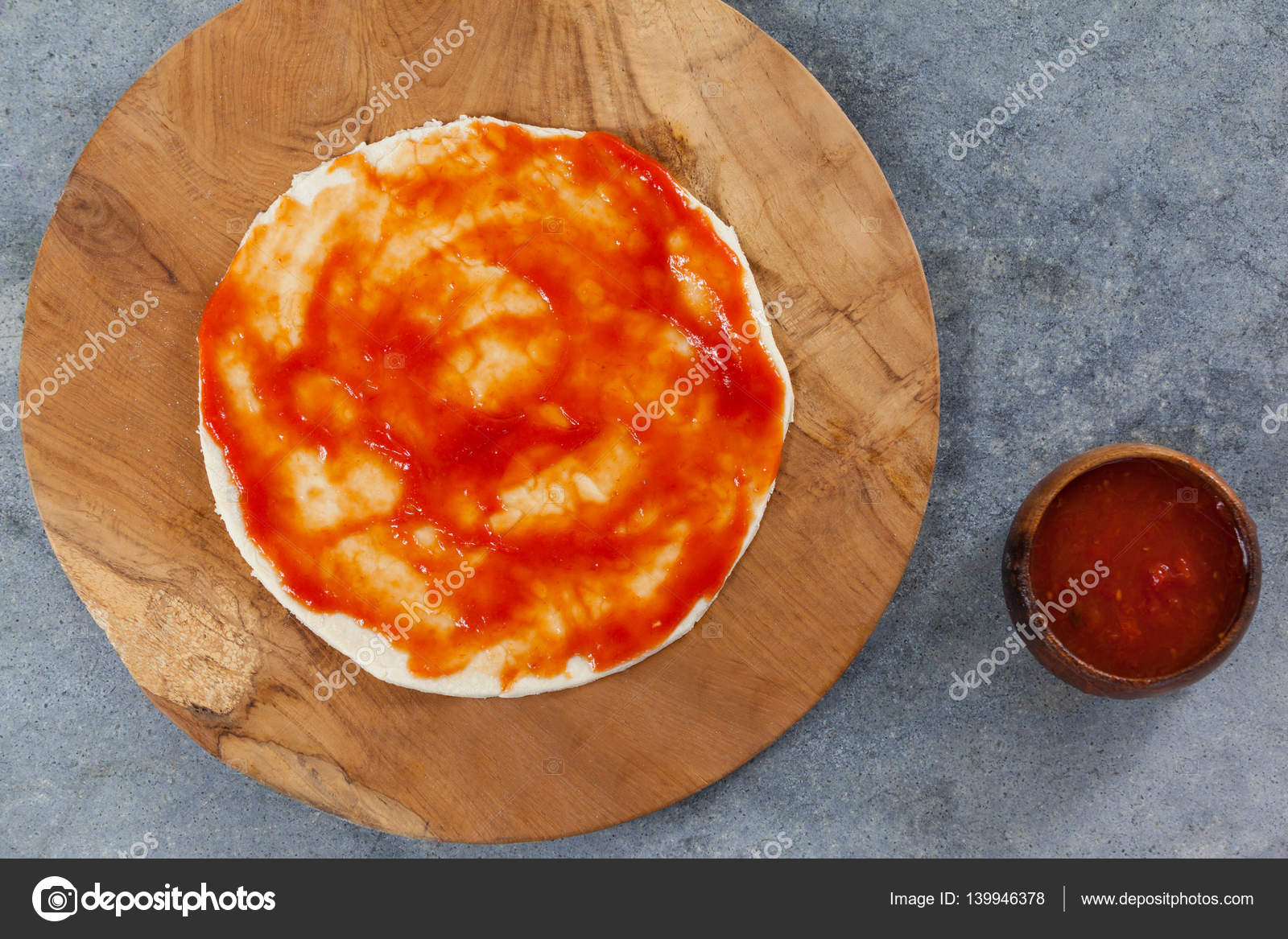 Pizza dough with tomato sauce — Stock Photo © Wavebreakmedia 139946378