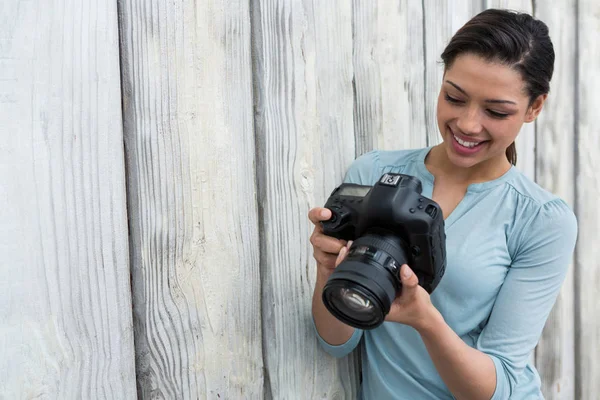 Photographer reviewing captured photos — Stock Photo, Image