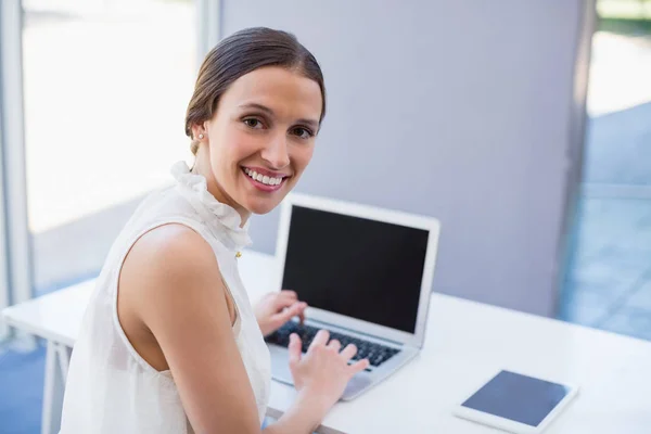 Beautiful woman using laptop — Stock Photo, Image