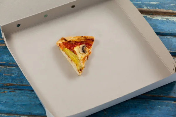 Slice of pizza in pizza box — Stock Photo, Image