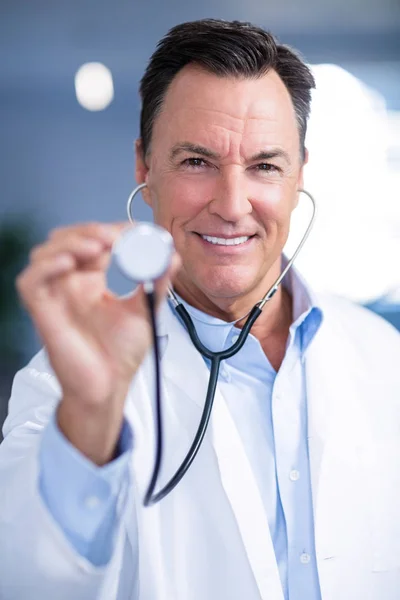 Portrait of male doctor holding stethoscope — Stock Photo, Image