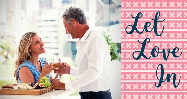 Mature couple toasting white wine — Stock Photo, Image