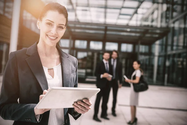 Businesswoman holding digital tablet — Stock Photo, Image