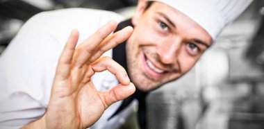 smiling male cook gesturing okay clipart