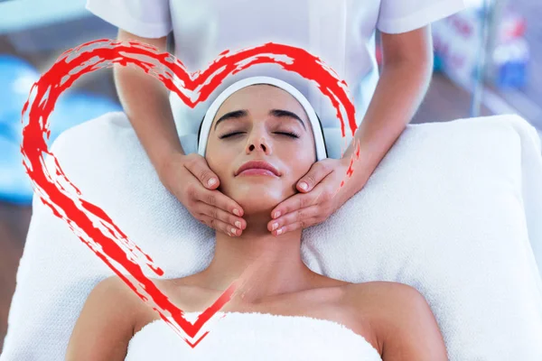 Woman receiving face massage — Stock Photo, Image