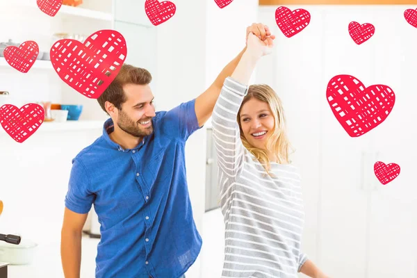 Couple dancing in kitchen — Stock Photo, Image