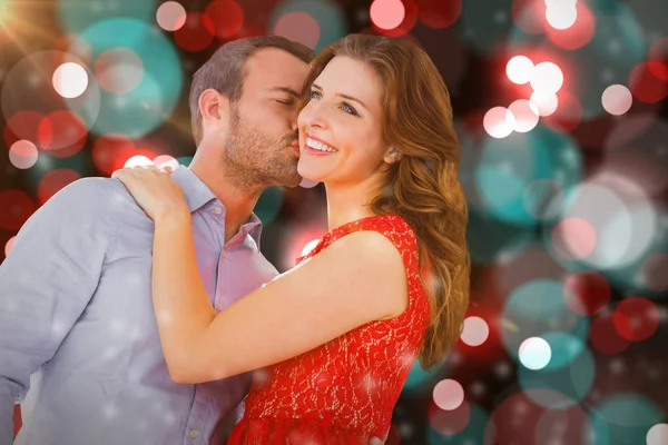 Man kissing woman on cheek — Stock Photo, Image