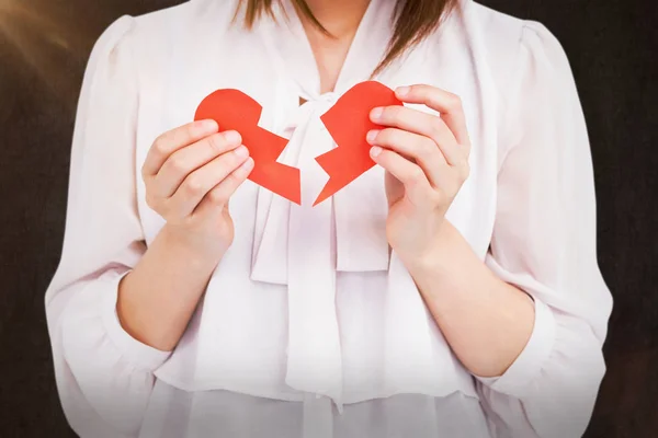 Woman holding broken heart paper — Stock Photo, Image