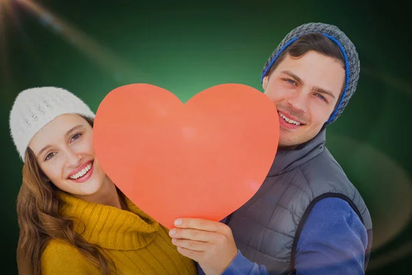 Couple holding heart shape paper — Stock Photo, Image