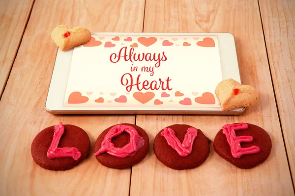 Dulces de amor con un touchpad — Foto de Stock