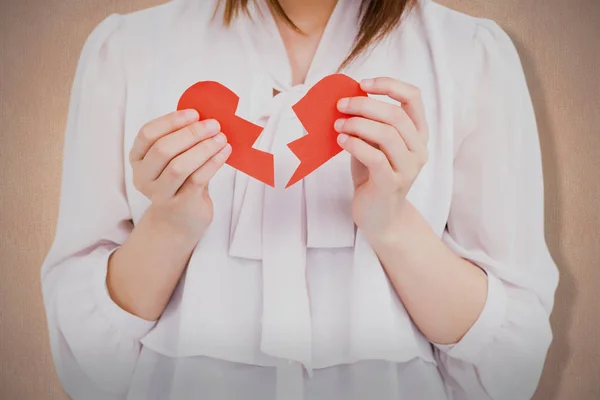 Woman holding broken heart paper — Stock Photo, Image