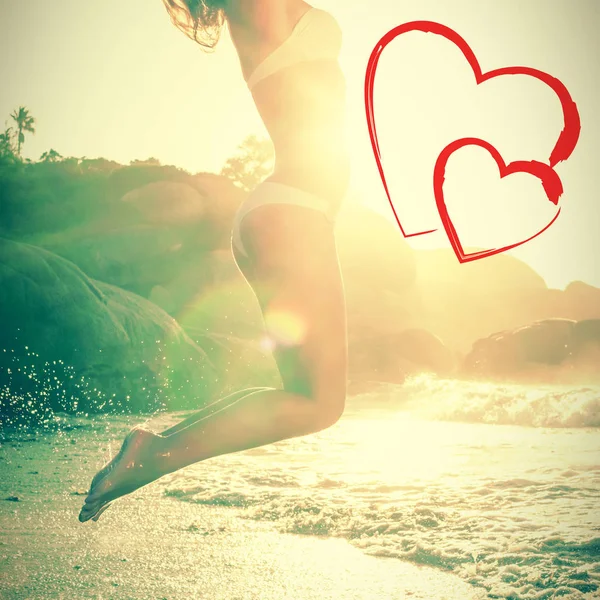 Jumping blond in white bikini — Stock Photo, Image