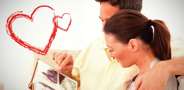 Lovely couple looking at pictures — Stock Photo, Image