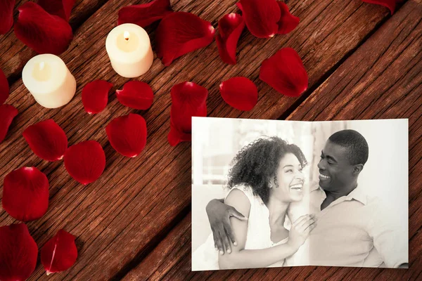 Attractive couple cuddling on couch — Stock Photo, Image