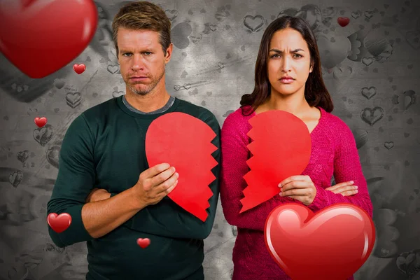 Couple holding cracked heart shape — Stock Photo, Image