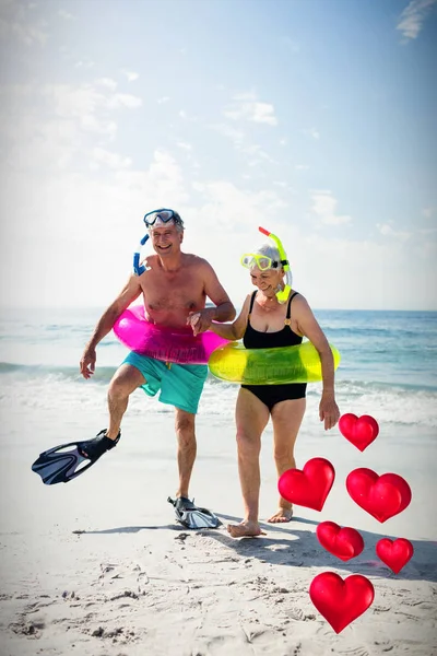 Senior couple enjoying on beach — Stock Photo, Image