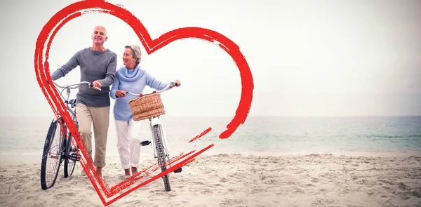 Coppia anziana con le loro biciclette — Foto Stock